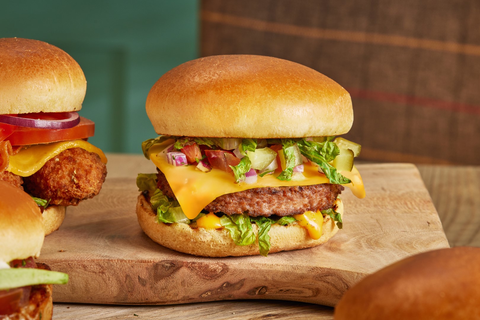 Brewers Fayre The Vegan Burger GARDEN GOURMET® Sensational™ burger with a Violife slice, lettuce, gherkin, red onion & burger sauce in a brioche style bun.